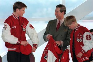 (VCR 112) VANCOUVER, Mar.24--Prince William (Left) and his father Prince Charles and brother Prince Harry (Right) try on jackets and hats from the Canadian Olympic Team Uniform after being presented with them at a environmental heritage event in Vancouver Tuesday. (CP PHOTO) 1998 (stf-Chuck Stoody)fng